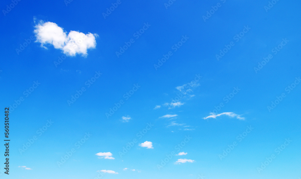 white fluffy clouds with rainbow in the blue sky white fluffy clouds with rainbow in the blue sky