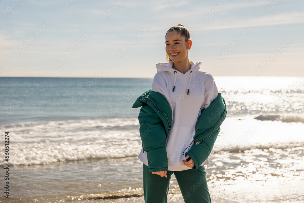 A young athletic girl against the backdrop of the sea A young athletic girl against the backdrop of the sea