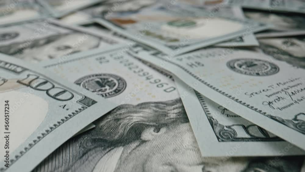 Close up money dollars bills in cash, scattered on surface. USD currency of United Stated of America