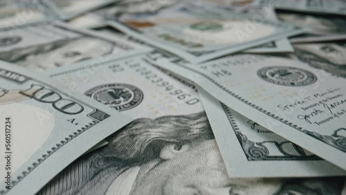 Close up money dollars bills in cash, scattered on surface. USD currency of United Stated of America