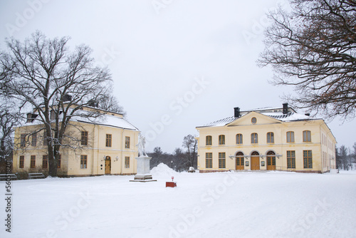 Theater of Drottningholm Palace, the residence of the Swedish royal family. Drottningholm is near the capital Stockholm, Sweden. The park is covered in snow.