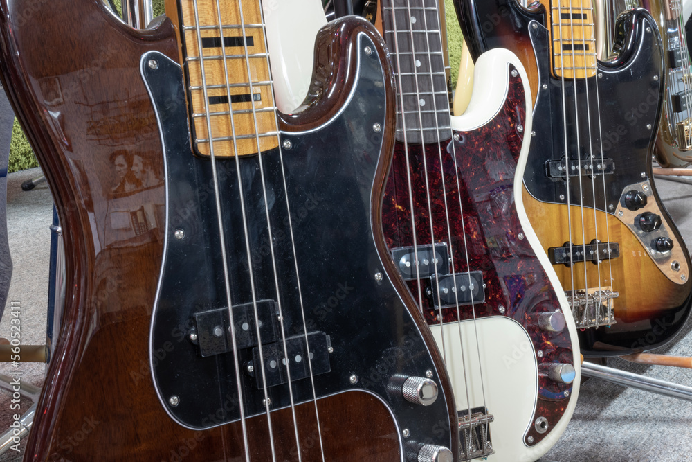 Fender Jazz and Precision bass guitar display at a music store. Fender