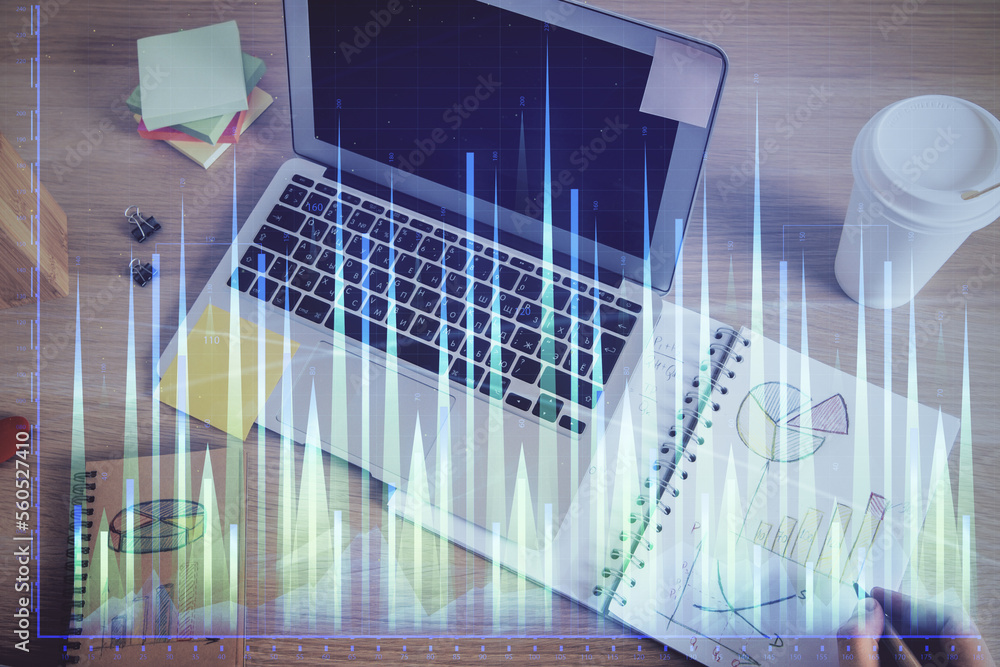 Double exposure of man's hands writing notes of stock market with forex chart. Double exposure of man's hands writing notes of stock market with forex chart.
