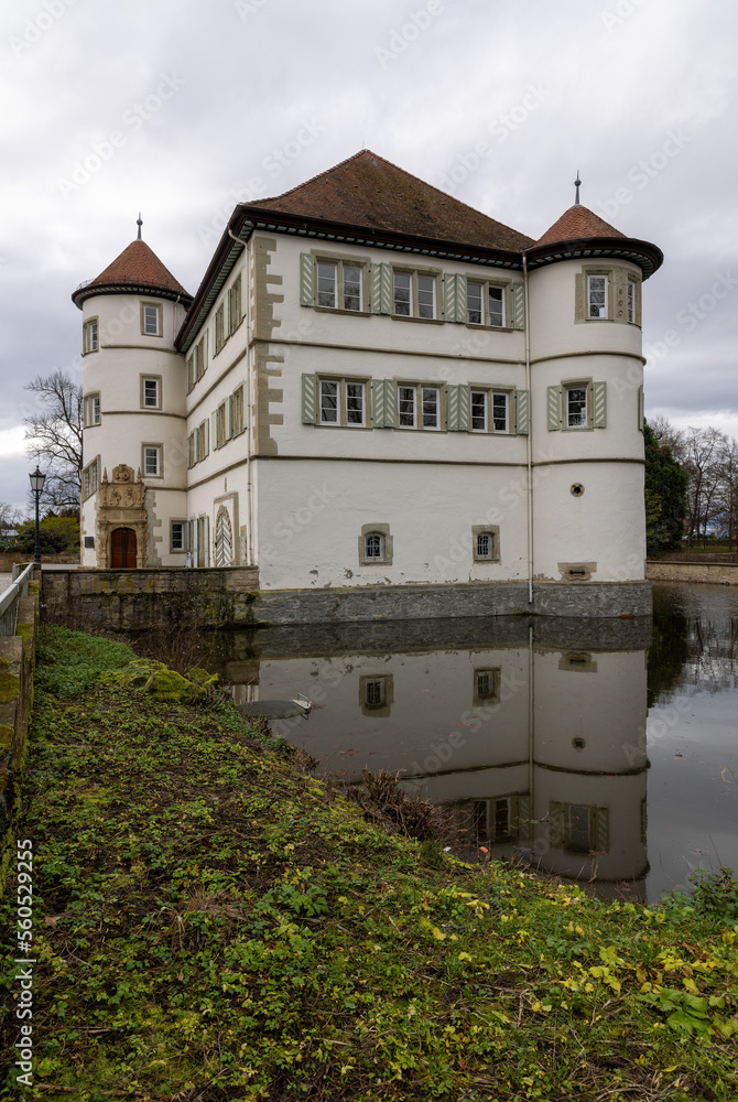 old moated castle of Bad Rappenau in winter with moat and reflection