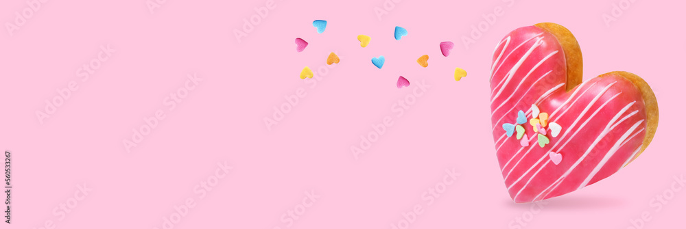 Pink donut in the form of heart on a pink background