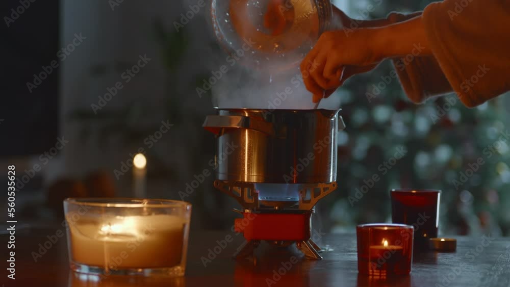 Cooking diner on a portable stove during blackout, tourist gas burner