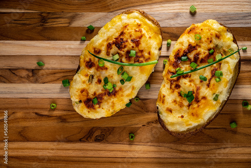 Cheesy twice-baked potato garnished with chopped scallion