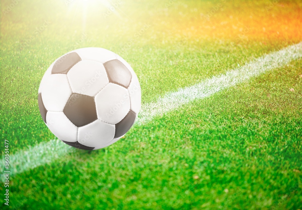 Fototapeta premium Classic soccer ball in big field stadium.