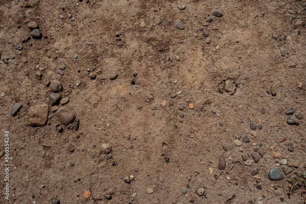 Dirty soil with small stones background Dirty soil with small stones background
