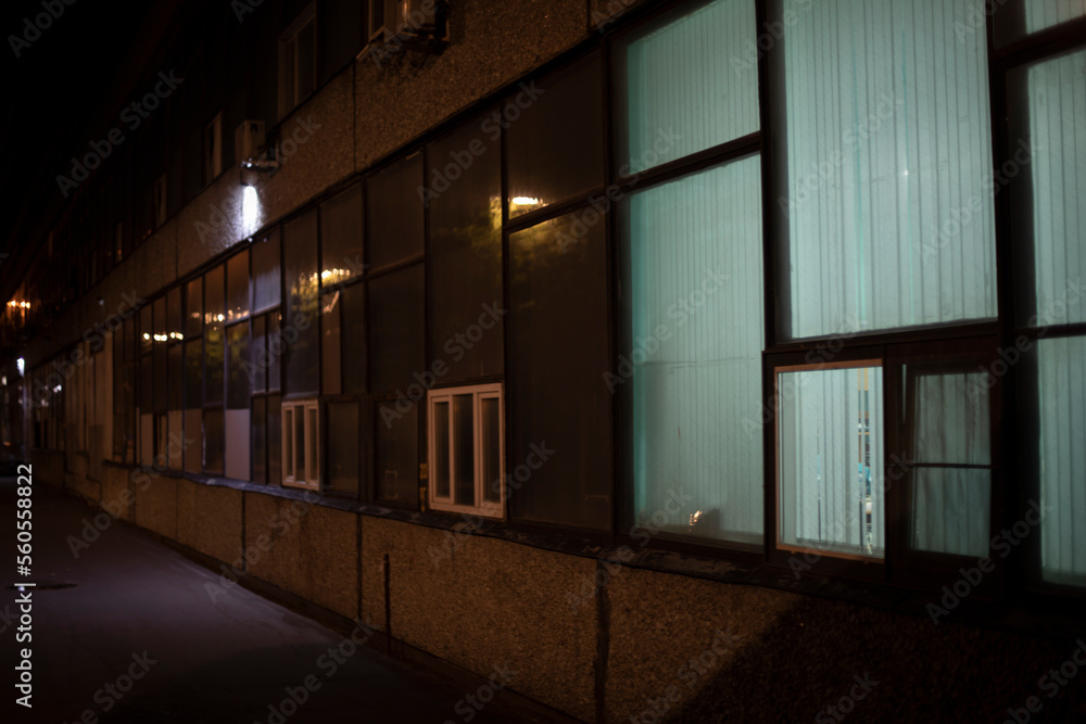 Window in building. Single window. Light in dark interior. Glass in evening. Window in building. Single window. Light in dark interior. Glass in evening.