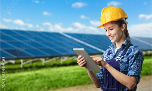 Young engineer worker inspecting a solar panel