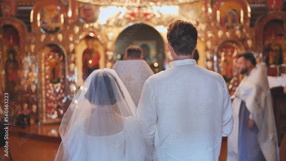 Newlyweds at a church russian wedding ceremony. Newlyweds at a church russian wedding ceremony.