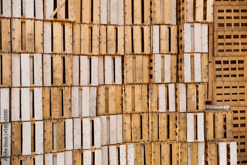 Closeup of empty slatted wooden crates stacked in pile