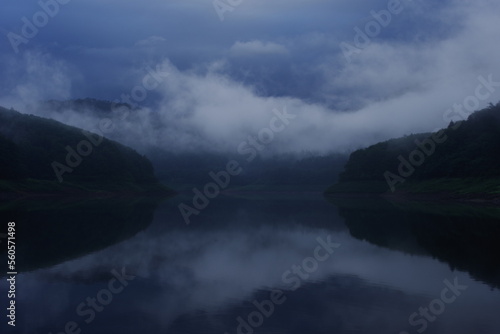 Landscape photo with fog on the lake. A quiet and lonely impression.