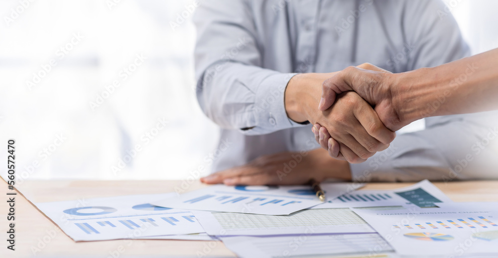 Business handshake for teamwork of business merger and acquisition,successful negotiate,hand shake,two businessman shake hand with partner to celebration partnership and business deal concept Business handshake for teamwork of business merger and acquisition,successful negotiate,hand shake,two businessman shake hand with partner to celebration partnership and business deal concept