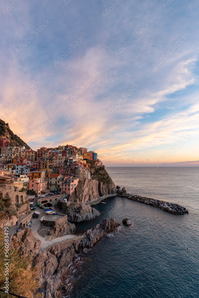 Small touristic town on the coast, Manarola, Italy. Cinque Terre. Colorful Sunny Sunset Fall Season.