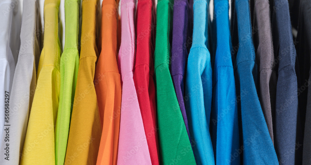 Colorful t-shirts hanging on a rack