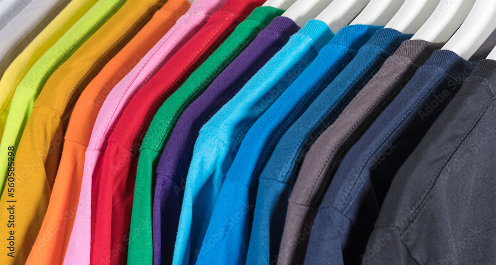 Colorful t-shirts hanging on a rack Colorful t-shirts hanging on a rack
