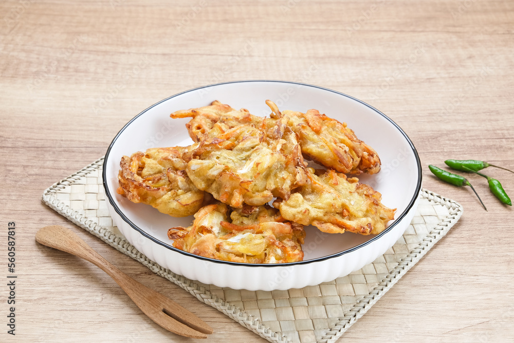 Bakwan sayur or bala-bala or vegetable fritter, Indonesian snack made from flour, cabbage, carrots and bean sprouts, served with chili
Bakwan sayur or bala-bala or vegetable fritter, Indonesian snack made from flour, cabbage, carrots and bean sprouts, served with chili