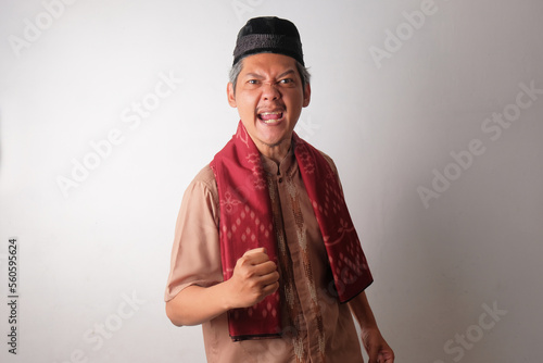 happy asian muslim man clenched his hands