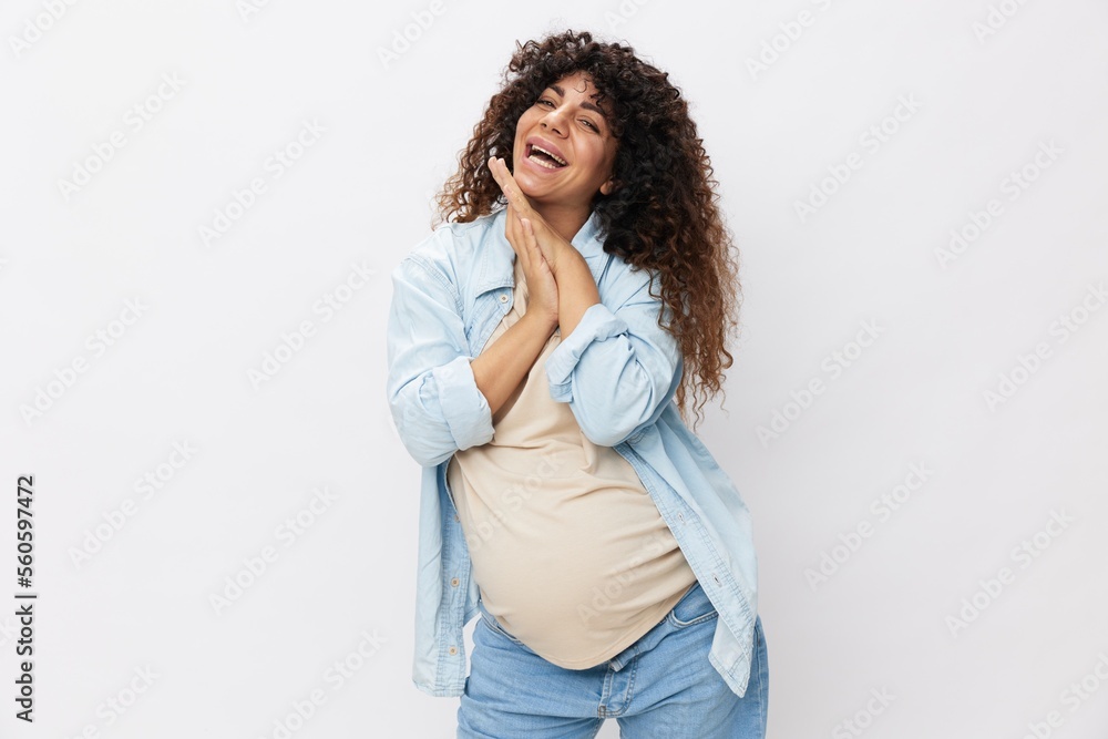 Pregnant woman smile and happiness, curly hair, big belly before delivery, Mother's Day white isolated background in T-shirt with blue shirt