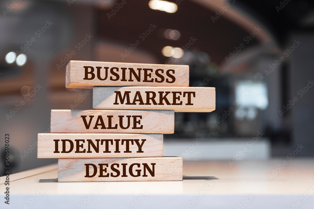Wooden blocks with words 'Business Market Value Identity Design'. Brand concept