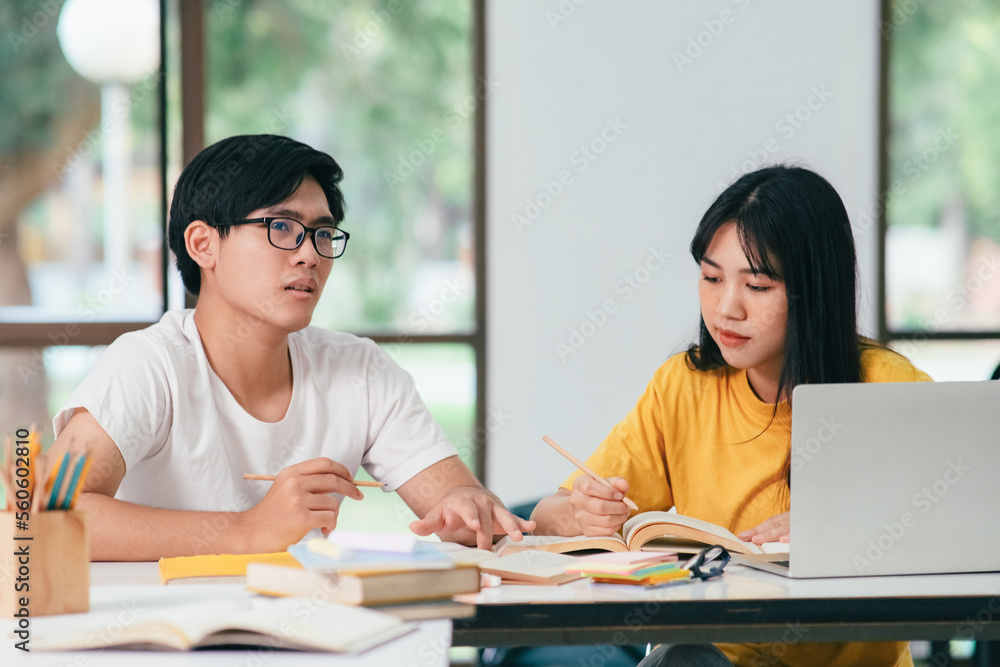 Young students campus helps friend catching up and learning. Young students campus helps friend catching up and learning.