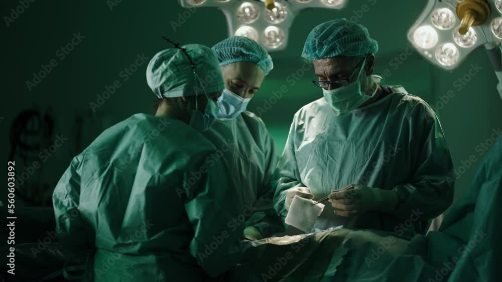 Team of proffesional doctors Performing a surgery in a clinic. Team of proffesional doctors Performing a surgery in a clinic.