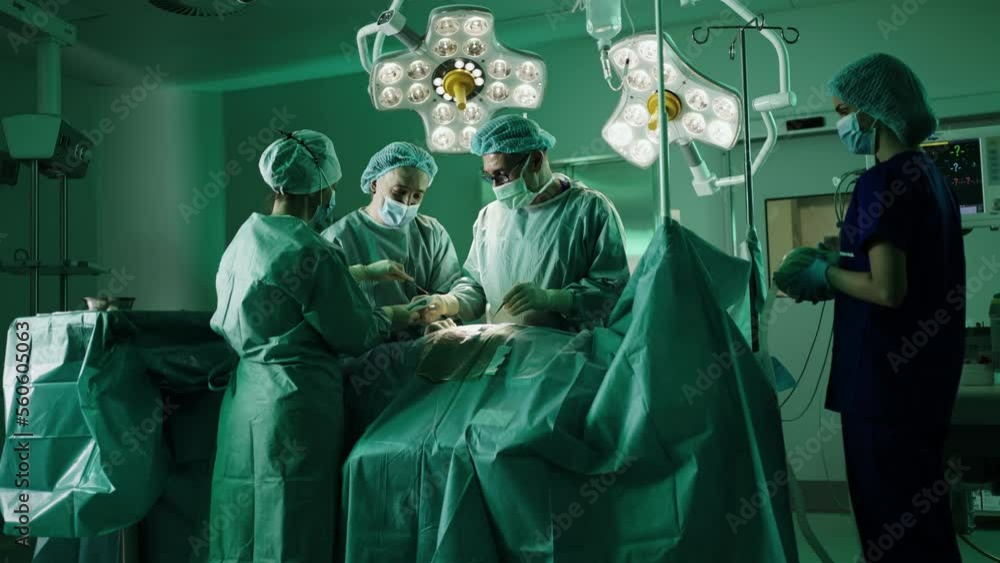 Team of proffesional doctors performing a surgery in a clinic. 