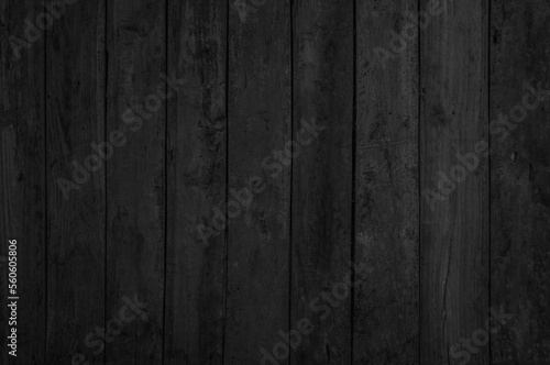 Grunge dark wood plank texture background. Vintage black wooden board wall. Painted weathered peeling table wood hardwood decoration.