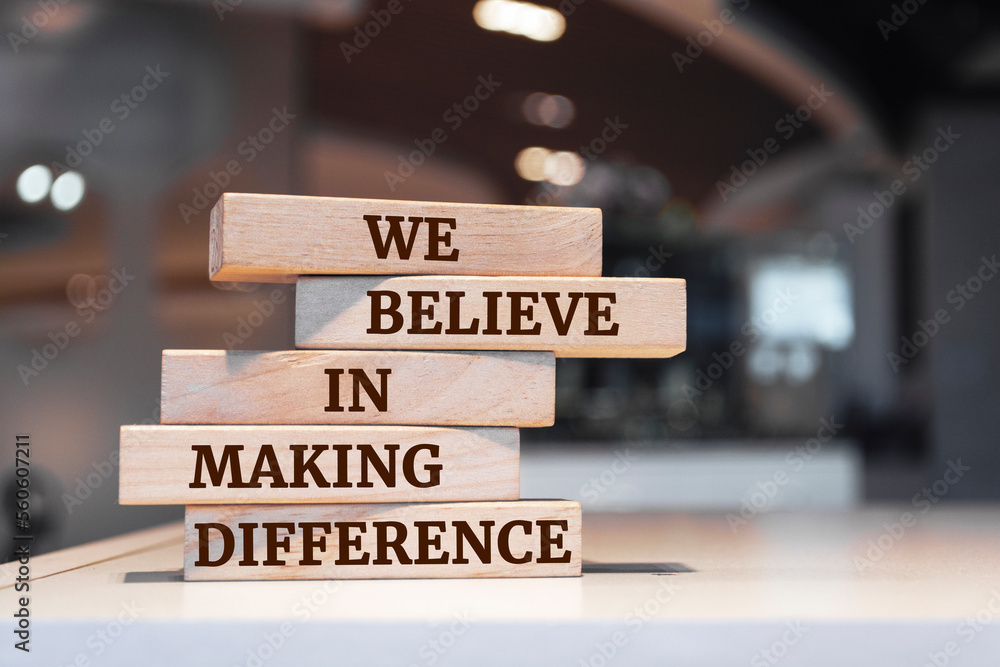 Wooden blocks with words 'We Believe in Making Difference'.