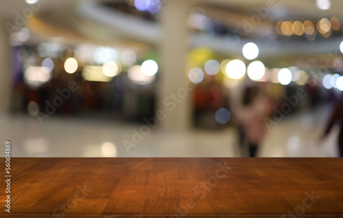 Empty wooden table in front of abstract blurred background of coffee shop . can be used for display or montage your products.Mock up for display of product