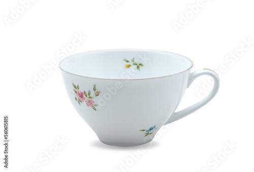 Empty white ceramic mug. Decorative flower pattern with one handle cup isolated on white background. Modern mug tea, coffee, or milk. Shiny bright color glazed vintage handmade for drinking water.