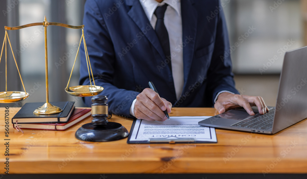 Close up of photo lawyer male notary working in a courtroom on wooden table office, Legal law, advice deal justice and law concept. Close up of photo lawyer male notary working in a courtroom on wooden table office, Legal law, advice deal justice and law concept.