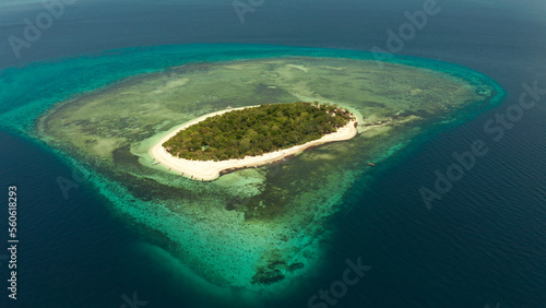 Small tropical island on an atoll with beautiful sandy beach surrounded by coral reef from above. Tropical island and coral reef. Summer and travel vacation concept, Camiguin, Philippines, Mindanao © Alex Traveler