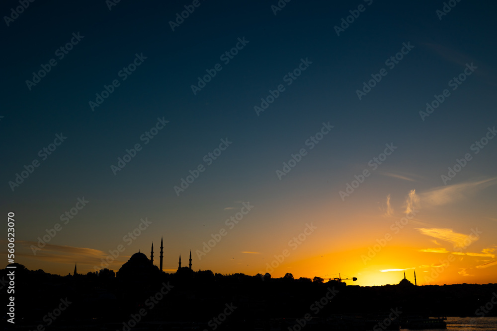Istanbul skyline at sunset. Suleymaniye Mosque and Fatih Mosque silhouette