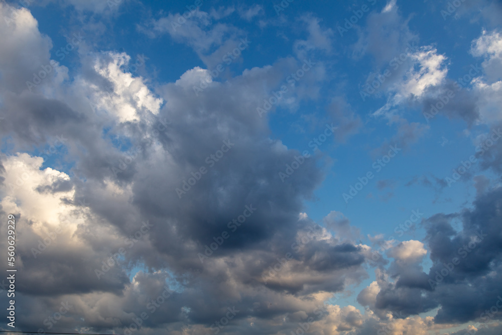 Obraz premium Thunderclouds in the sky at sunset.