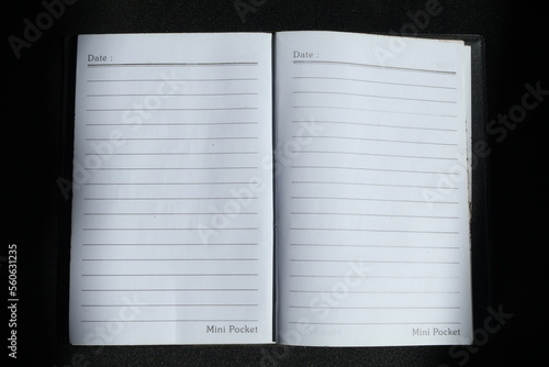notebook on dark isolated background