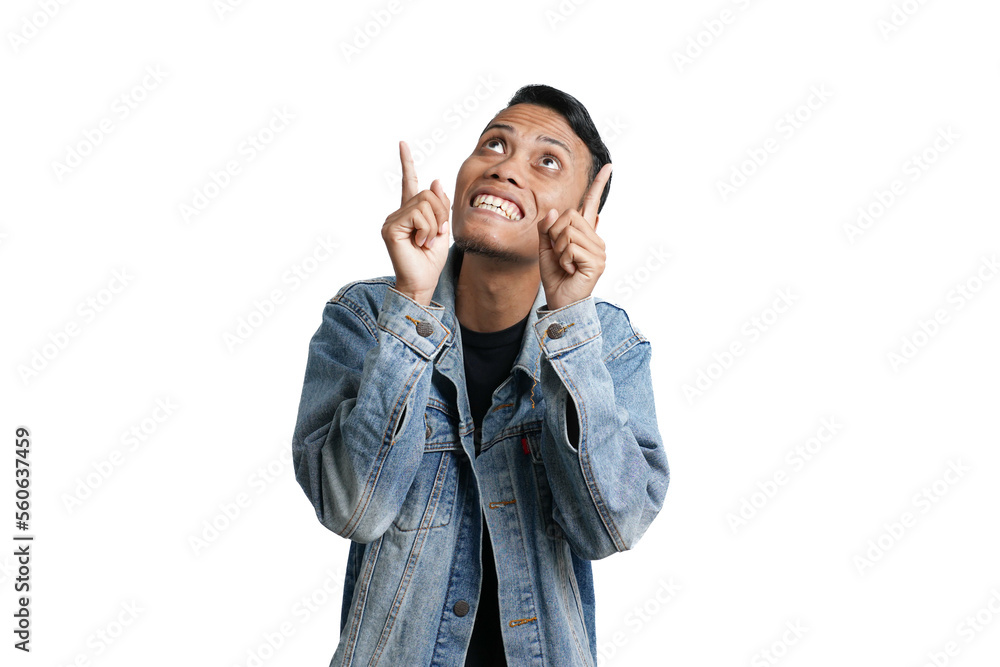asian man wearing blue jean jacket pointing up copy space for advertisement, isolated on white background asian man wearing blue jean jacket pointing up copy space for advertisement, isolated on white background