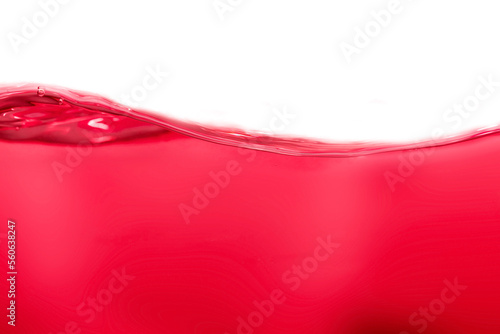 Drink clean red water in a glass and the bubbles look like splashes and waves.