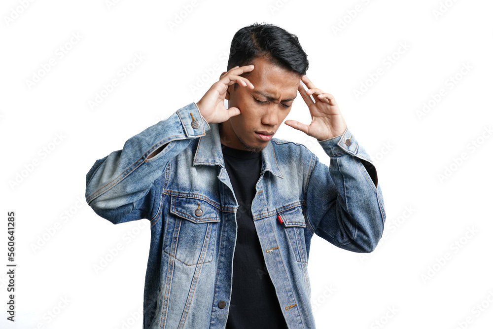 Asian man wearing blue jean jacket has headache or dizzy head. Isolated by white background Asian man wearing blue jean jacket has headache or dizzy head. Isolated by white background