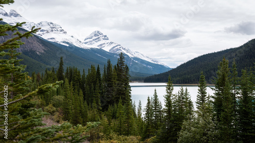 Snow-capped mountains and lake along Icefields parkway, Alberta, Canada. © Janice