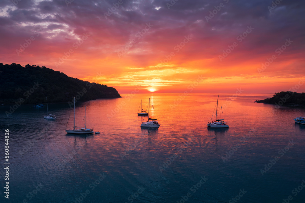 Beautiful sunset over tropical sea and sightseeing yacht in Koh Kood Island Beautiful sunset over tropical sea and sightseeing yacht in Koh Kood Island