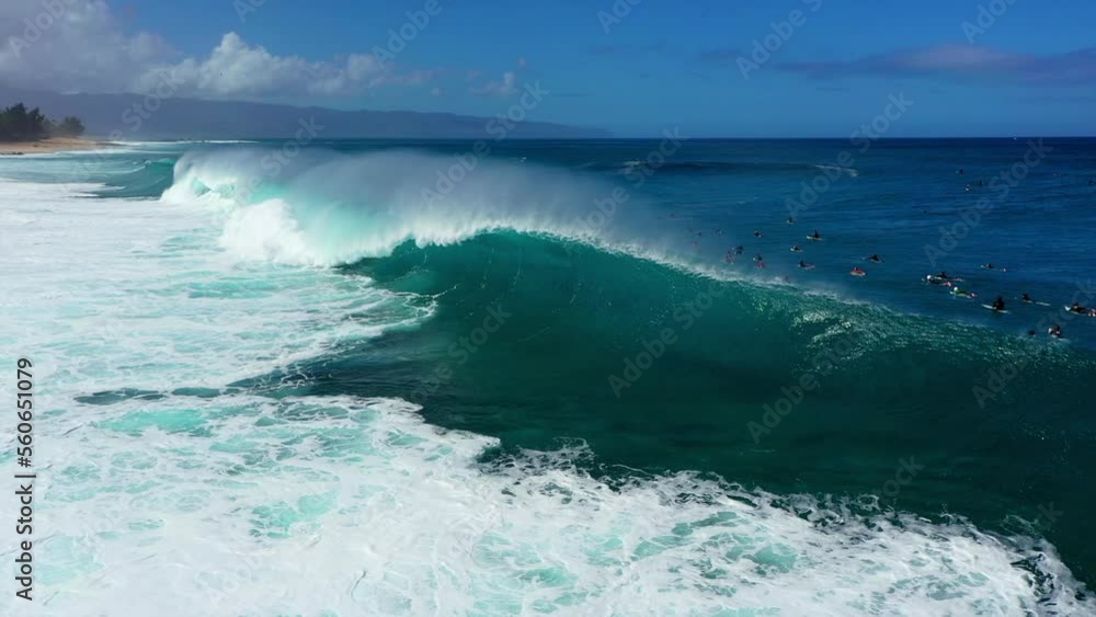 Aerial Backward Shot Of People Surfing On Waves In Ocean At Beach During Vacation - Waikiki, Hawaii Aerial Backward Shot Of People Surfing On Waves In Ocean At Beach During Vacation - Waikiki, Hawaii