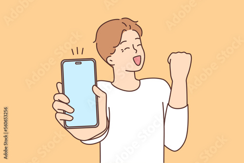 Overjoyed guy excited about message on cell 