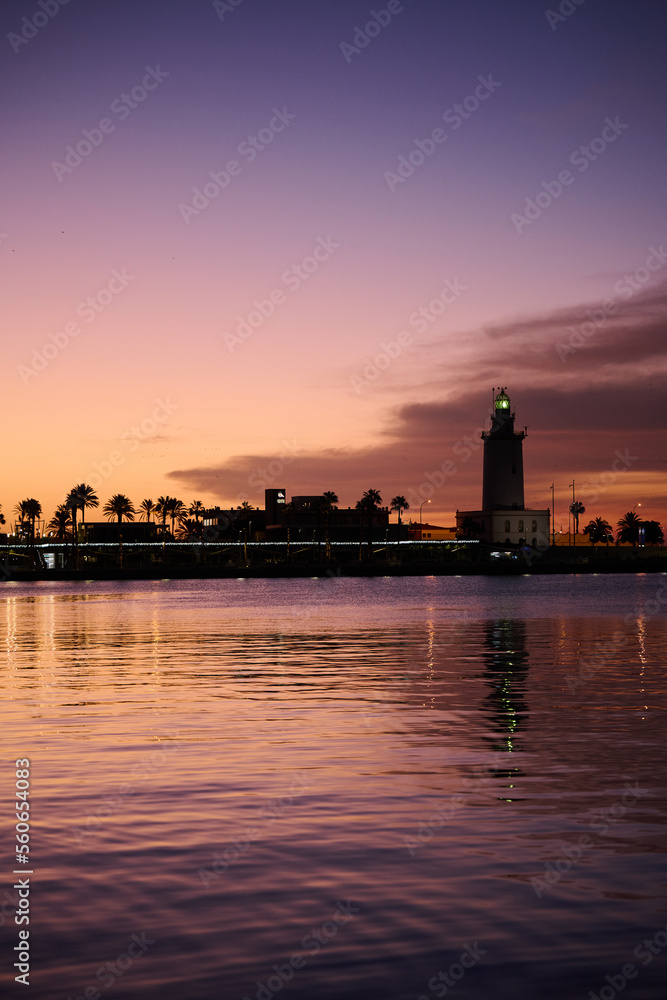 Lighthouse in Malaga at sunrise.