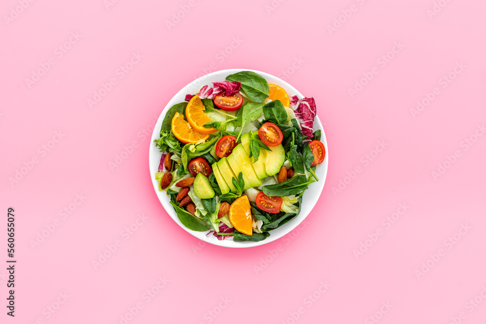 Vegan meal with healthy green salad - avocado and tomatoes in bowl Vegan meal with healthy green salad - avocado and tomatoes in bowl