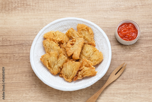 Crispy Fried Oyster Mushroom or Jamur Krispi served with chilli sauce, Indonesian snack 