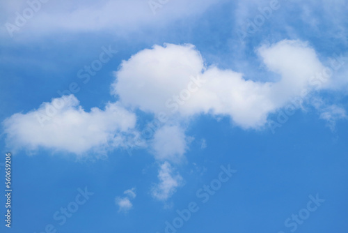 White Fluffy Clouds Floating on Bright Blue Sky