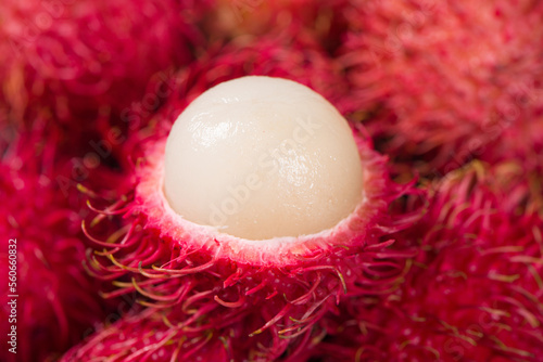 colse up of peeled ripe rambutan fruit background photo